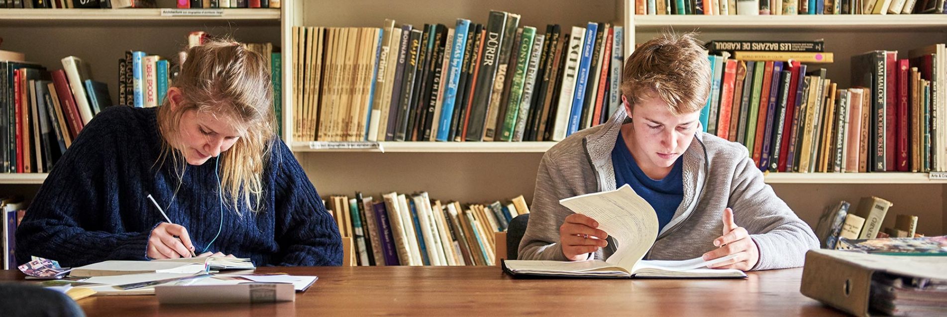 Students at Brockwood Park School studying in the library