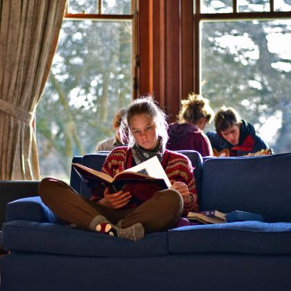 Brockwood Park School - Knowledge - A student reading a book