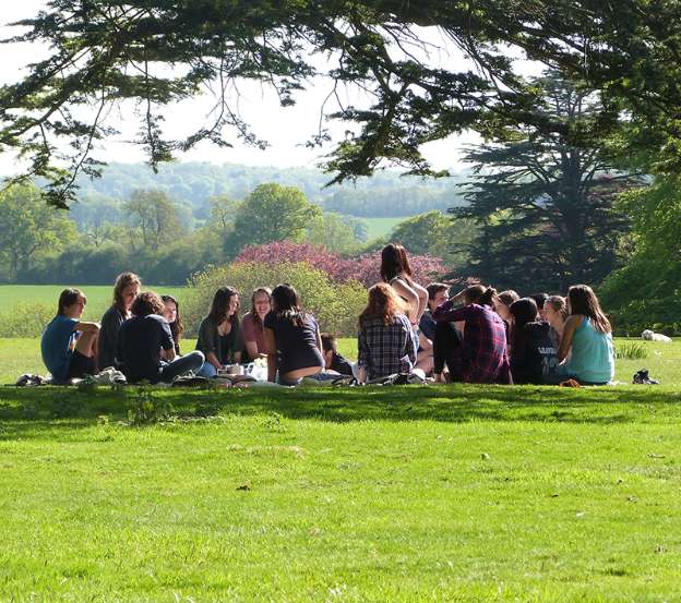 Brockwood Park School students having a picnic on the lawn